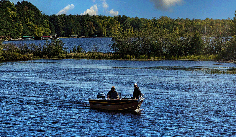 Fishermen fishing on lake